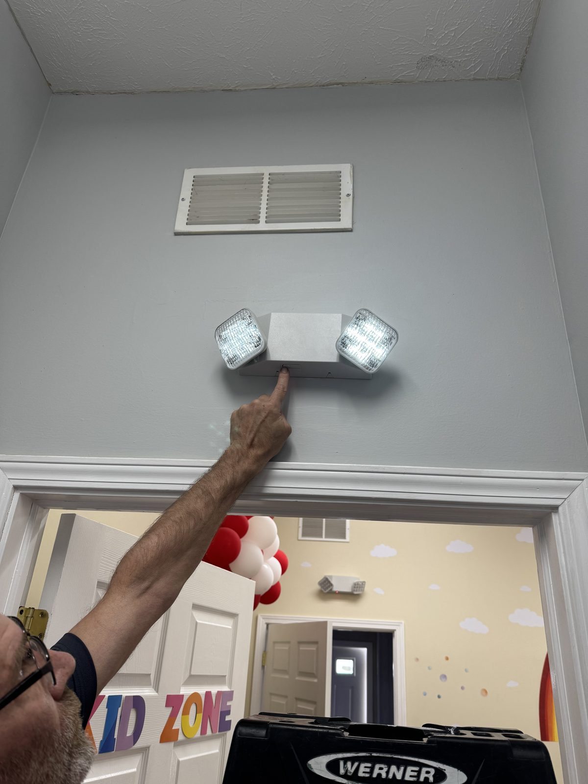 Fire extinguisher mounted with new NFPA 10 inspection tag