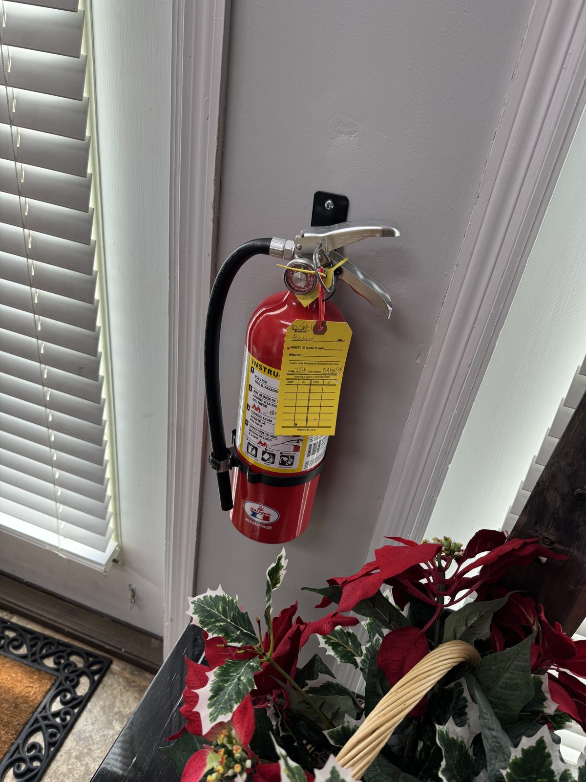 Apex Fire Protection technician installing emergency lighting